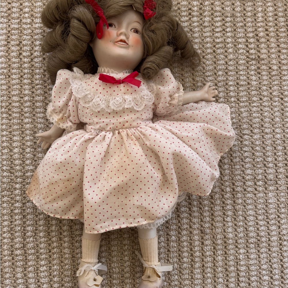 Red and White Porcelain Doll with Accessories